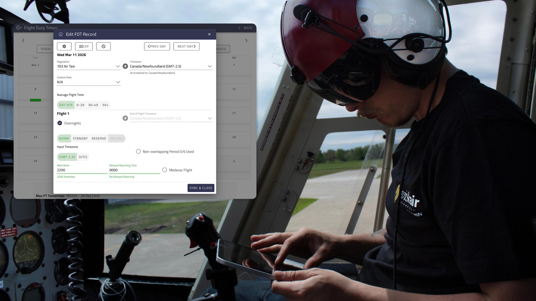 A helicopter pilot in a cockpit looking at a tablet. A screenshot of Cirro's FDT module is over the image to show his view.